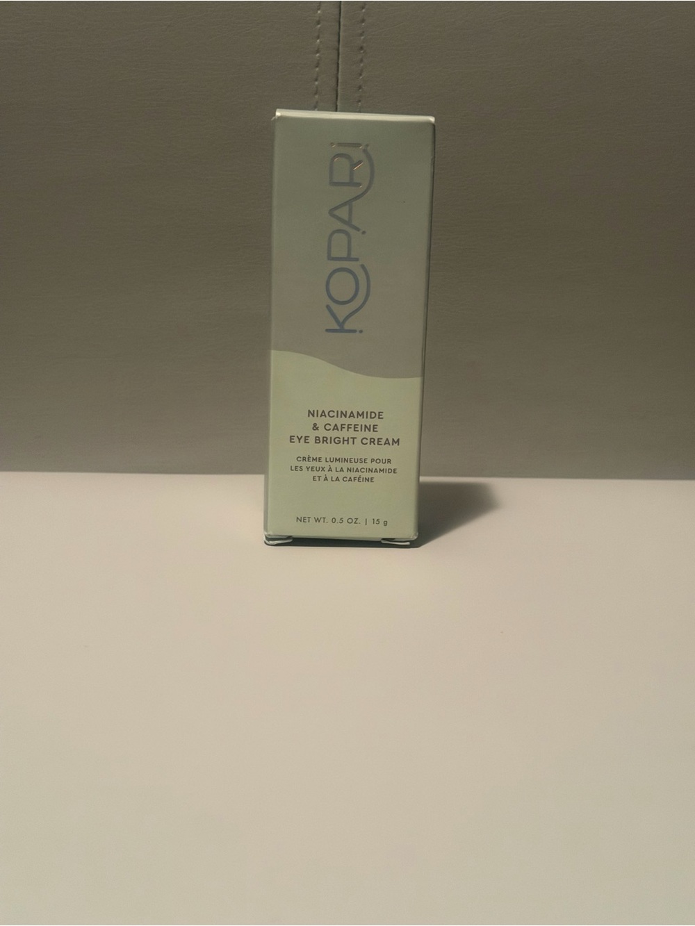 Kopari Eye Bright Cream in pale green and cream packaging